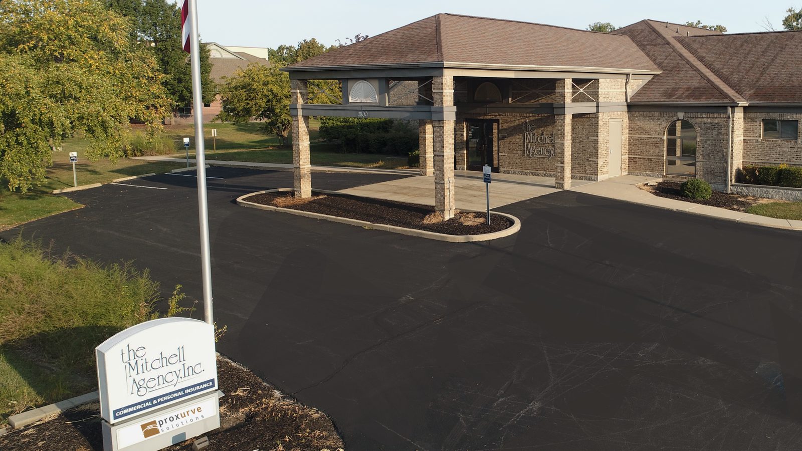 The Proxurve Solutions Lafayette office at 2800 Ferry Street, with the entrance sign and parking area